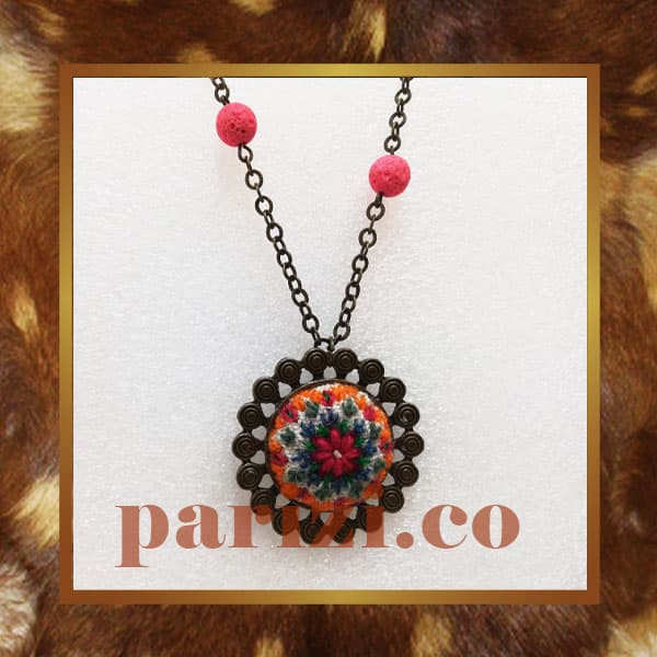 Traditional round necklace with white hand embroidery