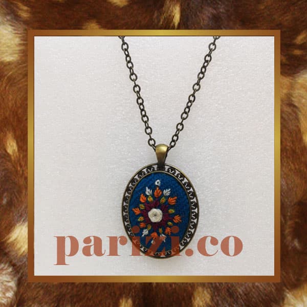 Traditional oval necklace with turquoise hand embroidery