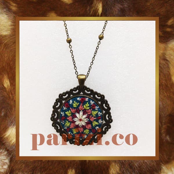 Traditional round necklace with turquoise hand embroidery